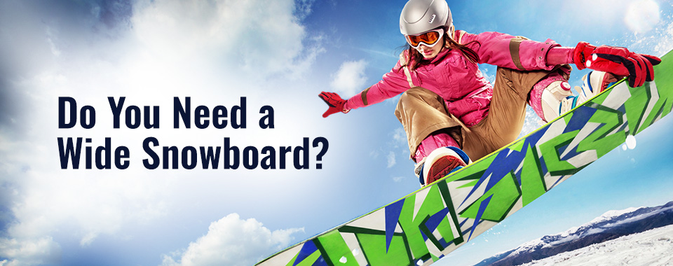 Snowboarder performing a jump in the mountains.